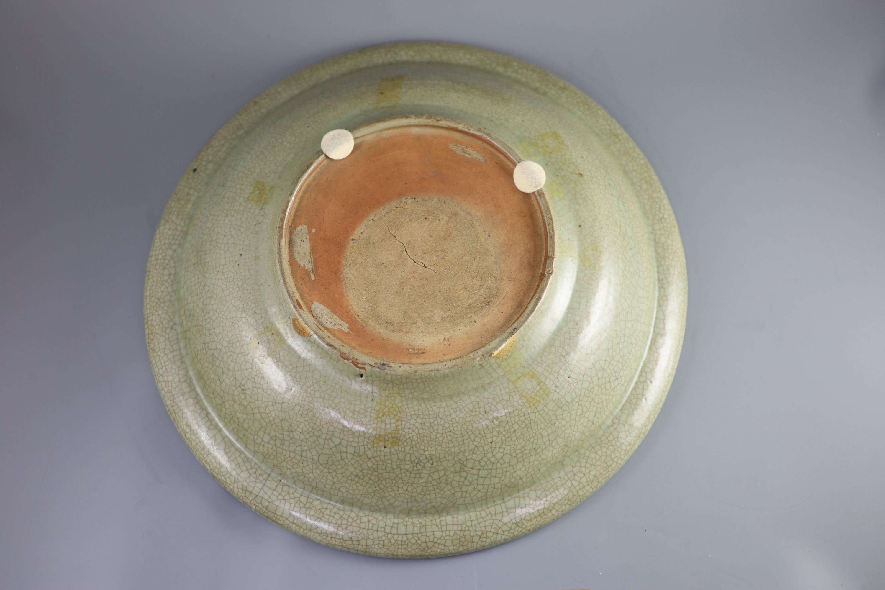 A Chinese Ming Longquan celadon dish, 15th/16th century, 43cm diameter